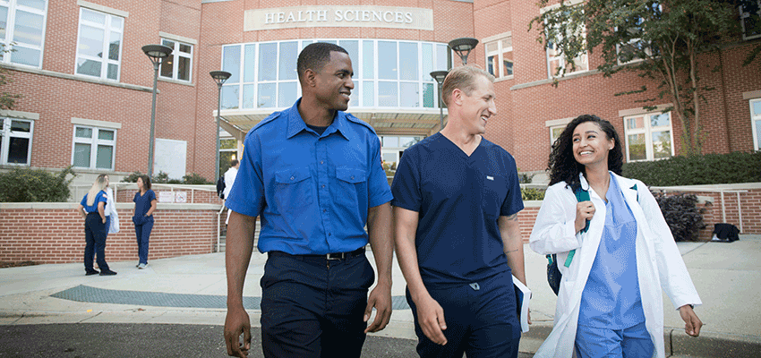 Image of students outside the Health Sciences building.