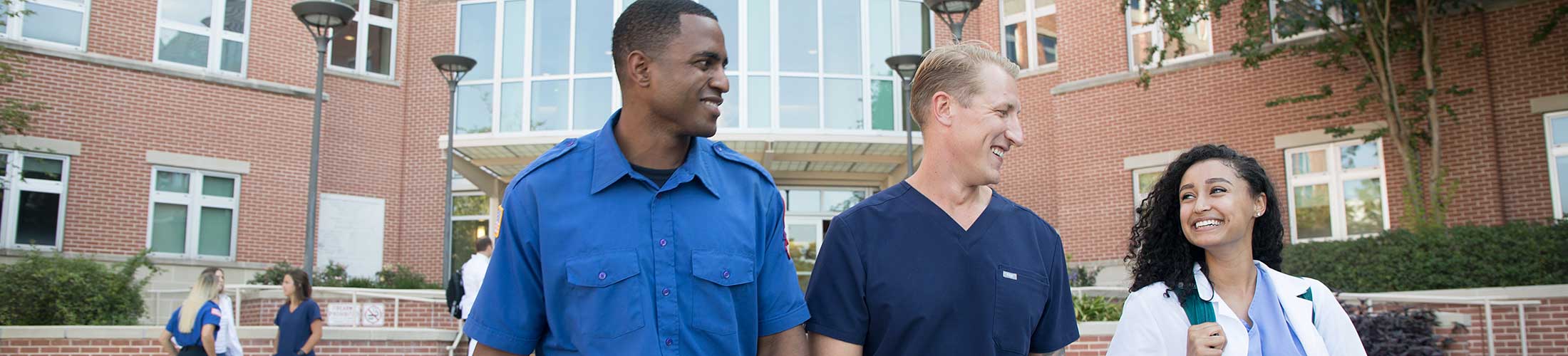 Allied Health students walking outside of the Allied Health building.