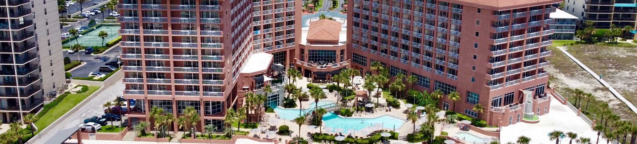 Hotel and pool at beach.