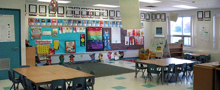 Elementary classroom with tables and chairs