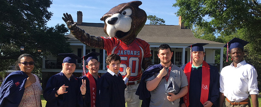 PASSAGE USA Graduates in front of Southpaw statue.