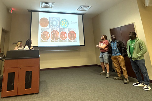 BMS students present at a TriBeta Biological Honor Society meeting. 