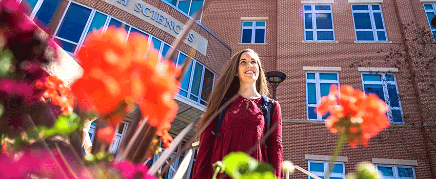 USA Student walking out of Health Sciences building