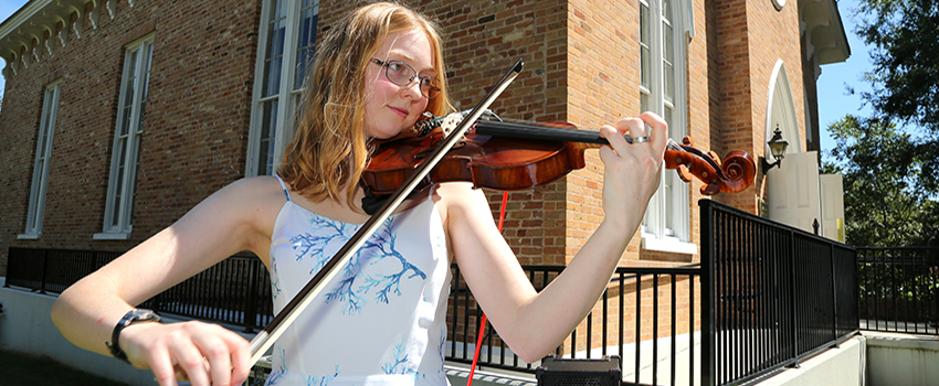 Honors student playing violin