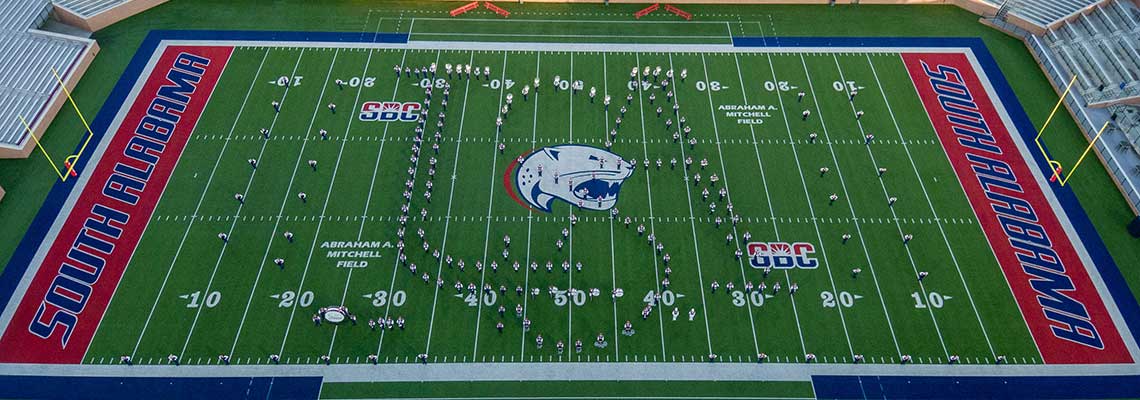 Aerial view of stadium with Jaguar Marching Band in formation