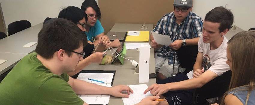 Students in a classroom having a group discussion