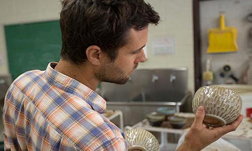 Student working in ceramics.
