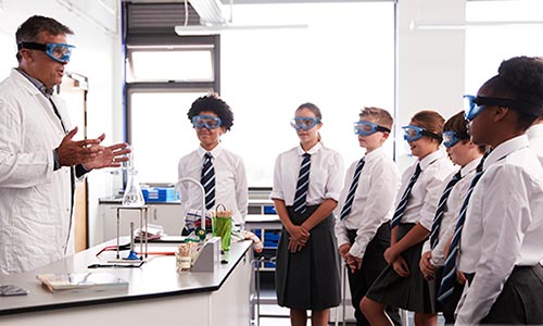 teacher with students in a laboratory