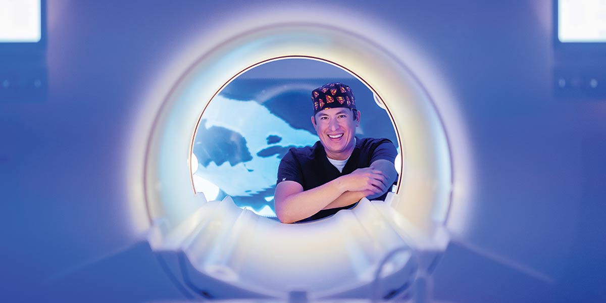 Dr. Kevin Wong with radiation machine. data-lightbox='featured'