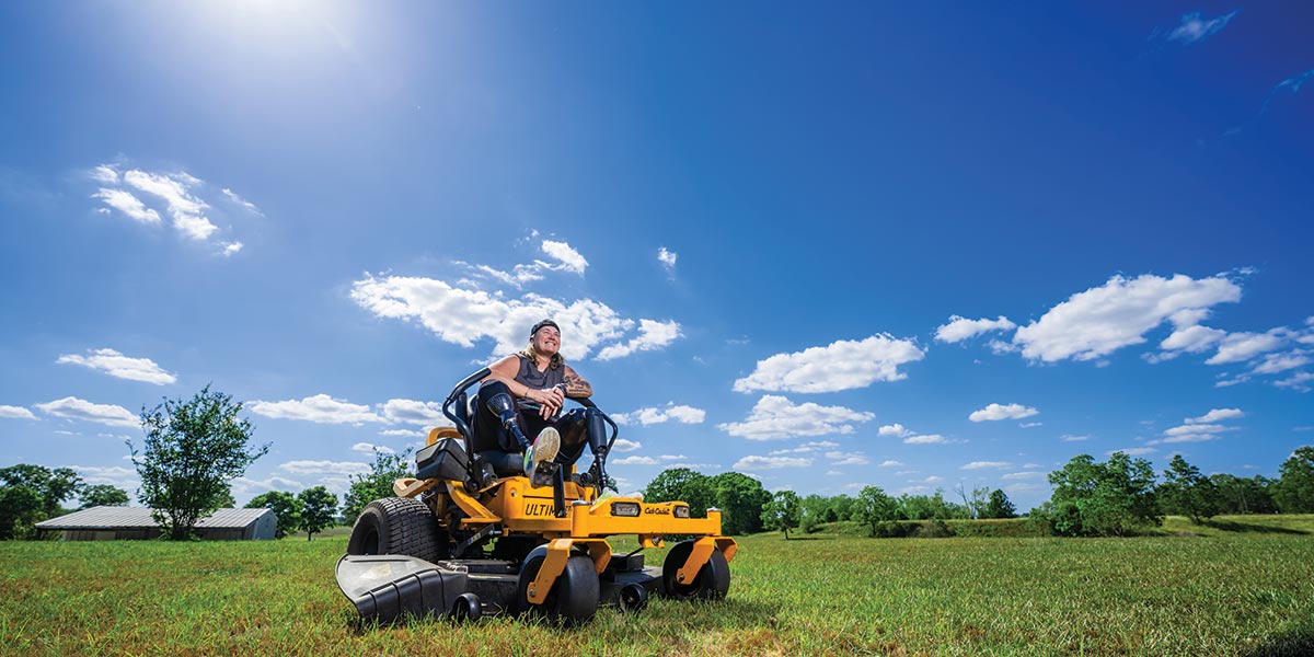 A woman mowing her 5 acres data-lightbox='featured'