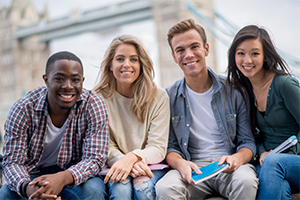 Group of students sitting and smiling.