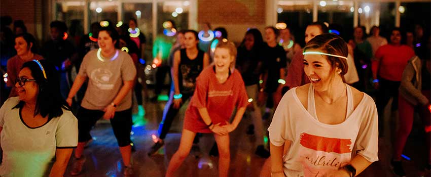 Zumba class with glow necklaces on