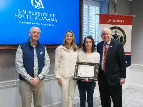 Amy O'Hara with Dr. Kent, President Jo Bonner, and management team.