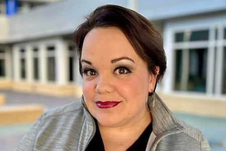 Dr. Rebecca Thomas photo of Dr. Rebecca Thomas standing in front of a building