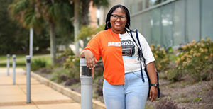 Female student standing outside.