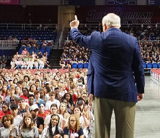 President Bonner holding up J sign.