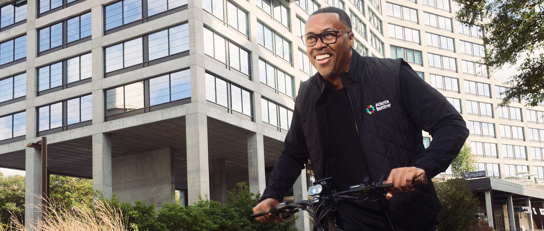 Clyde Higgs ’97, president and CEO of the Atlanta Beltline, bikes on the Beltline, one of the nation’s largest and most wide-ranging urban redevelopment programs.