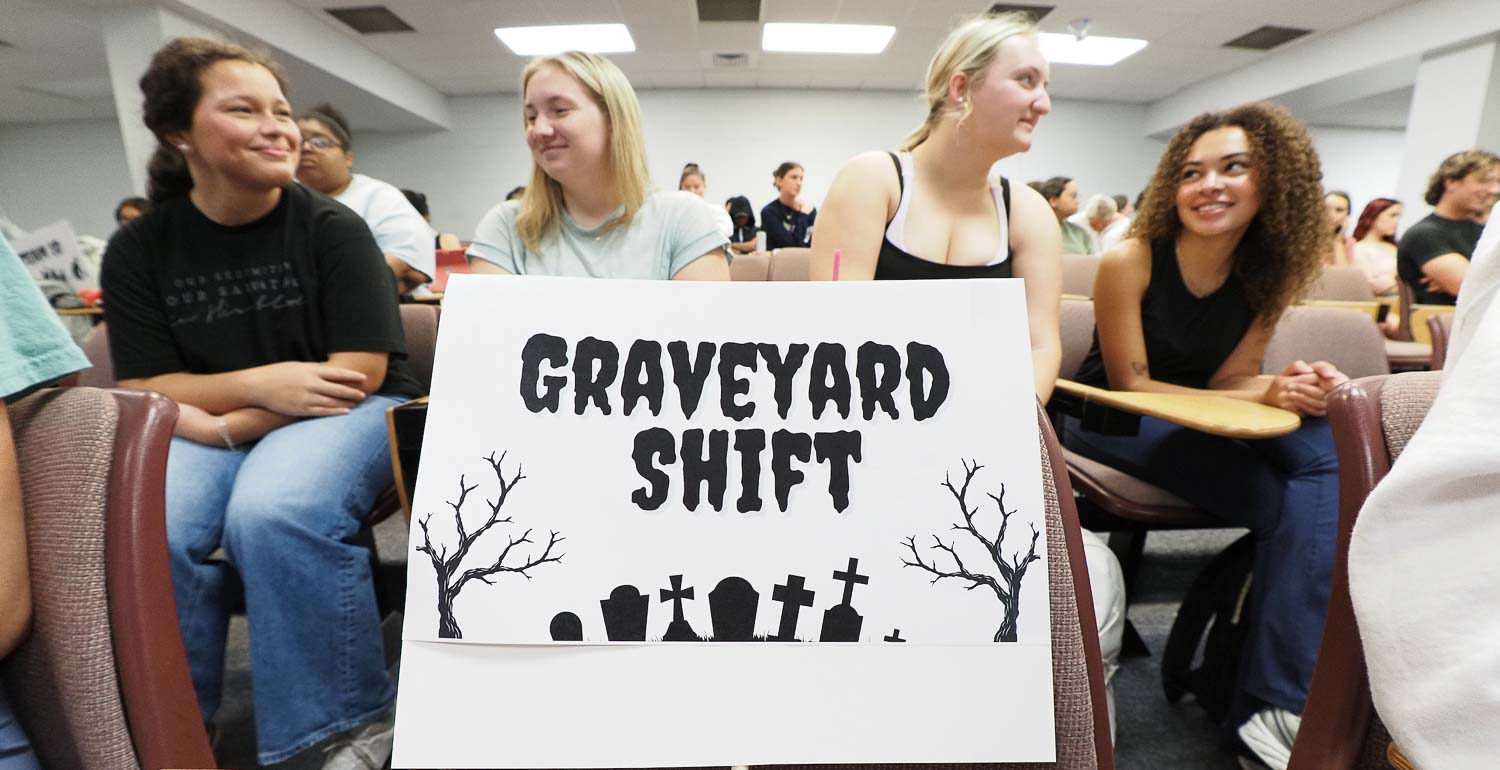 Members of Team Graveyard Shift plot their survival strategy in an Introduction to Sociology zombie apocalypse simulation. Students named their teams. Others were the Maze Runners, Plague Pals, PDRUUNS (People’s Democratic Republic of United Nation States), Aura,  Surviving and Thriving, Team 10, Jetsons, Petoria, The Last of Us and Apocalypse Alliance.