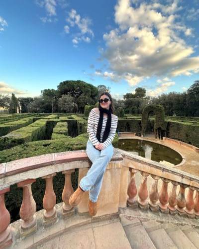 Woman sitting in front of garden